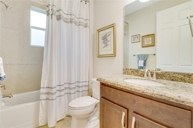 full bathroom featuring tile patterned floors, vanity, toilet, and shower / bath combo with shower curtain