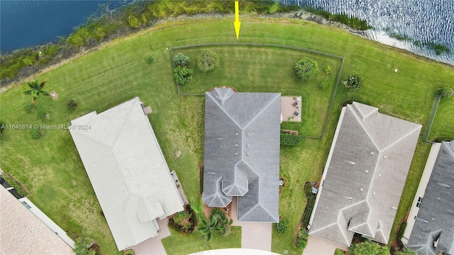 birds eye view of property featuring a water view