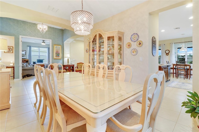 dining space featuring ceiling fan and light tile patterned flooring