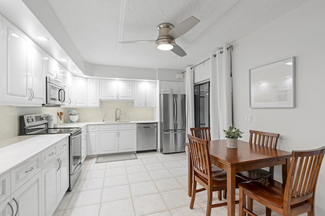 kitchen featuring white cabinetry, sink, and stainless steel appliances