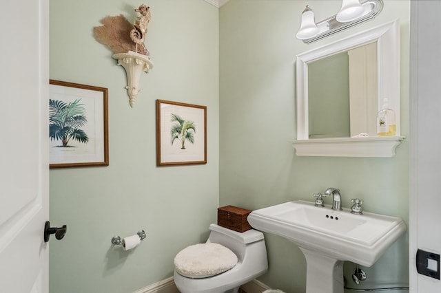 bathroom with toilet and sink