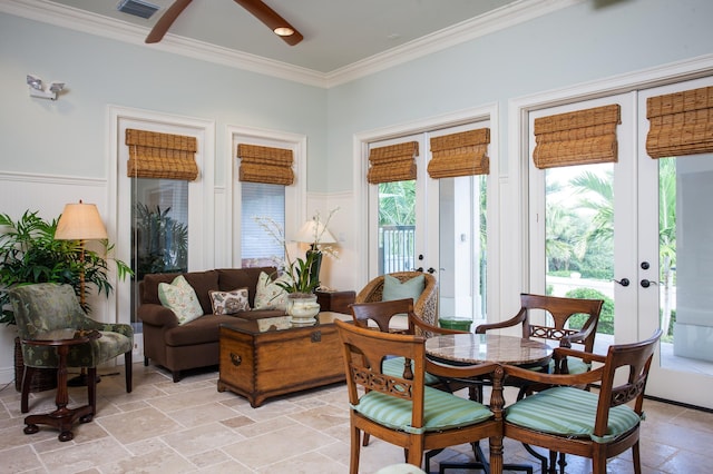 sunroom / solarium featuring french doors