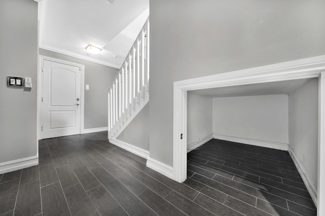 foyer featuring ornamental molding