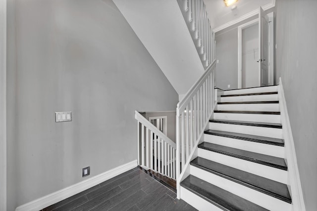 staircase with vaulted ceiling