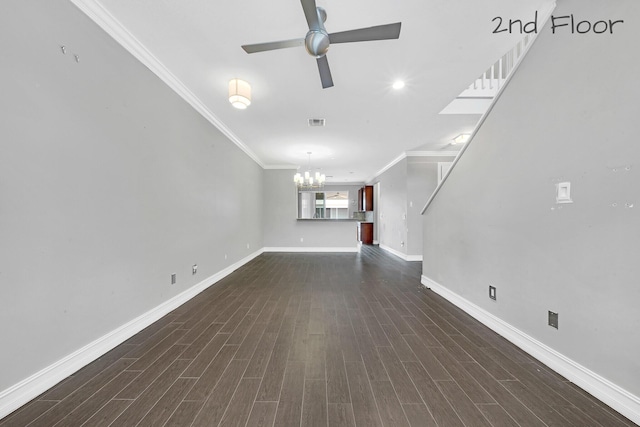 unfurnished living room featuring ceiling fan with notable chandelier, dark hardwood / wood-style floors, and crown molding