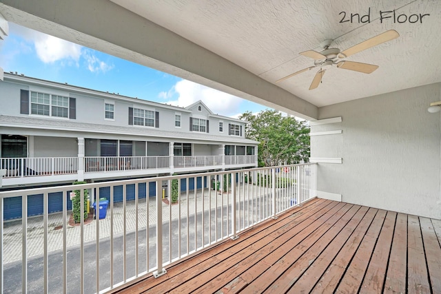 wooden terrace featuring ceiling fan