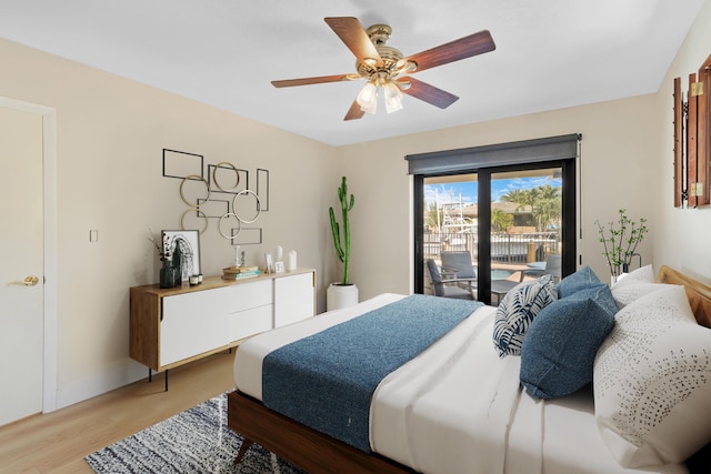 bedroom with ceiling fan, hardwood / wood-style flooring, and access to outside