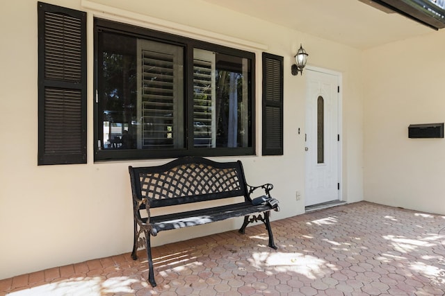 doorway to property with a porch