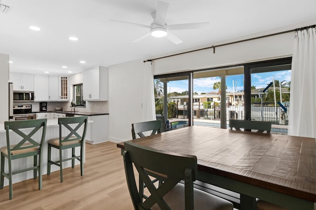 dining area with visible vents, a ceiling fan, light wood-style flooring, and recessed lighting