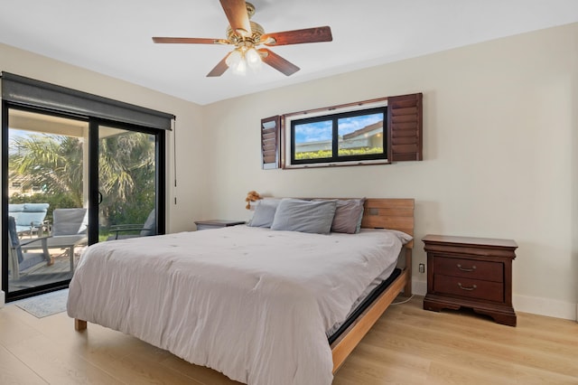 bedroom with baseboards, ceiling fan, light wood-type flooring, and access to exterior