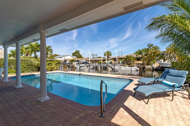 view of pool with a patio, fence, and a fenced in pool