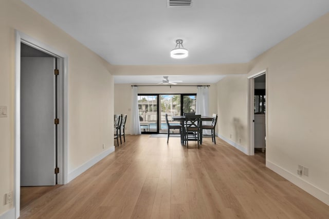 dining room featuring light hardwood / wood-style floors and ceiling fan