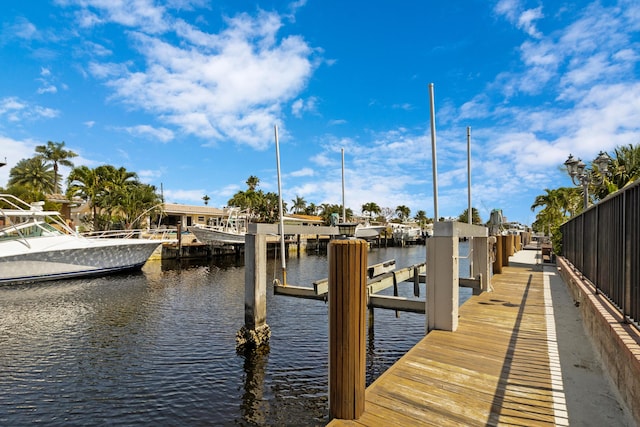 view of dock featuring a water view and boat lift