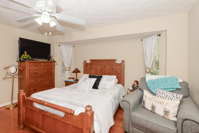 bedroom featuring ceiling fan and hardwood / wood-style floors