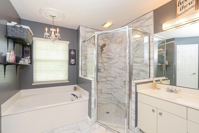 bathroom with separate shower and tub, vanity, and a chandelier