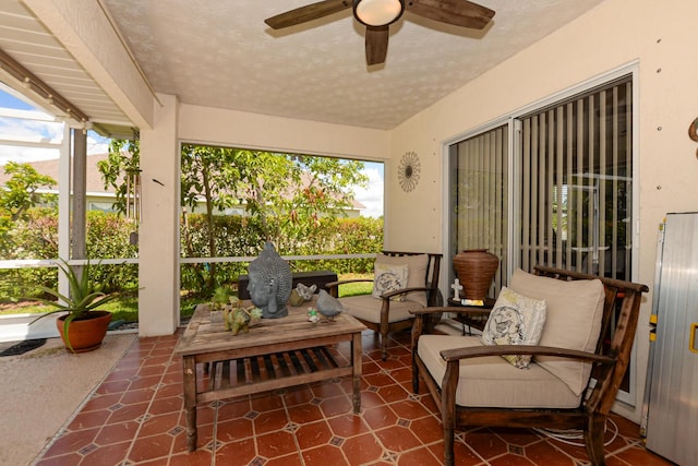 sunroom with ceiling fan