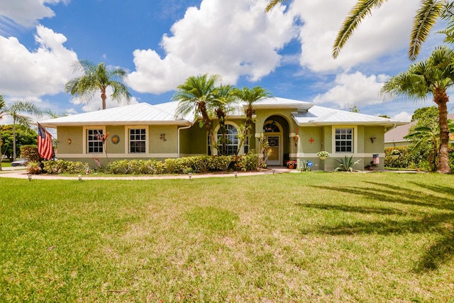 ranch-style home featuring a front lawn