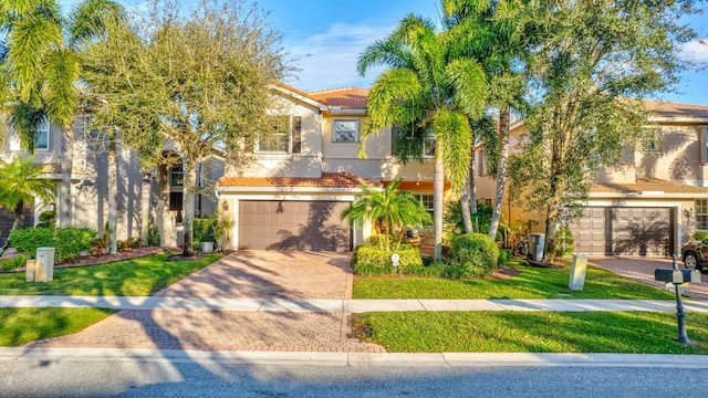 view of front of house featuring a front yard and a garage