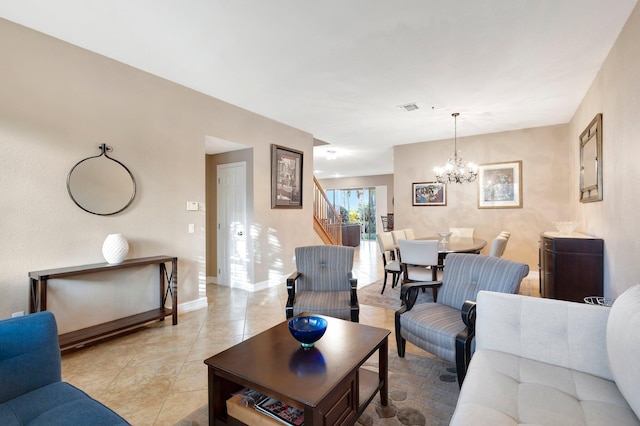 tiled living room with a notable chandelier