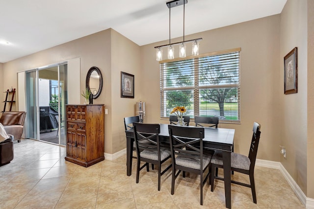 dining area with plenty of natural light and light tile patterned floors