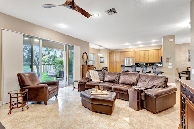 living room featuring ceiling fan