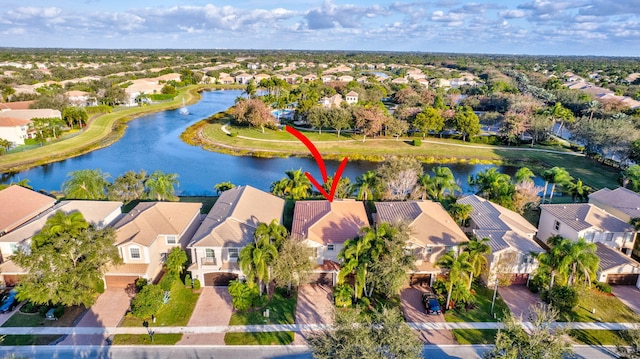 birds eye view of property with a water view