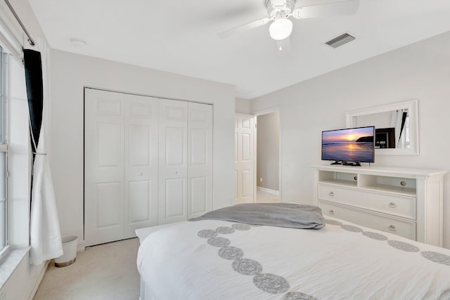 11606 Ponywalk Trl, Boynton Beach, FL 33473 - bedroom featuring visible vents, ceiling fan, a closet, and light colored carpet