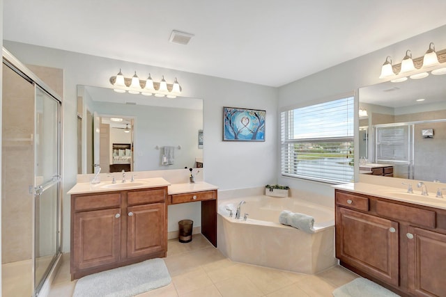 bathroom featuring tile patterned flooring, separate shower and tub, and vanity