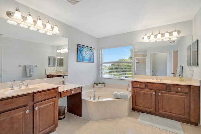 bathroom featuring separate shower and tub, vanity, and tile patterned flooring