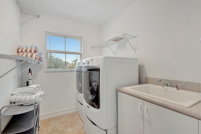 11606 Ponywalk Trl, Boynton Beach, FL 33473 - clothes washing area featuring laundry area, baseboards, separate washer and dryer, a sink, and light tile patterned floors