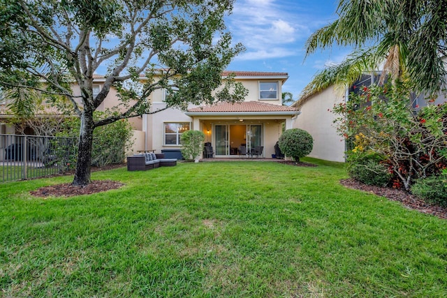 11606 Ponywalk Trl, Boynton Beach, FL 33473 - rear view of house with an outdoor living space, a tile roof, fence, a yard, and stucco siding