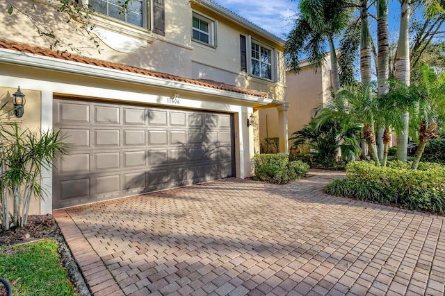 mediterranean / spanish house featuring a garage