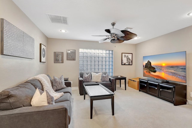 living room with light carpet and ceiling fan