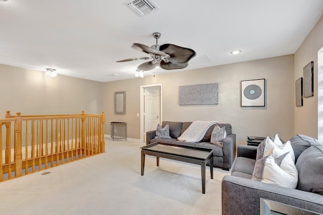 living room featuring ceiling fan and light carpet