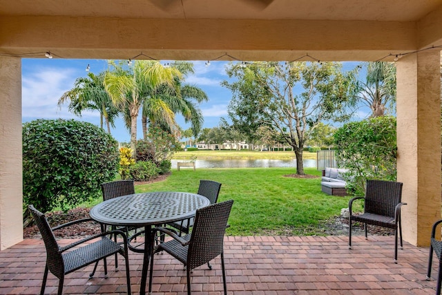 view of patio with a water view