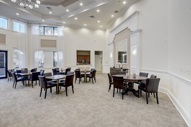 11606 Ponywalk Trl, Boynton Beach, FL 33473 - dining space with visible vents, a towering ceiling, and light carpet