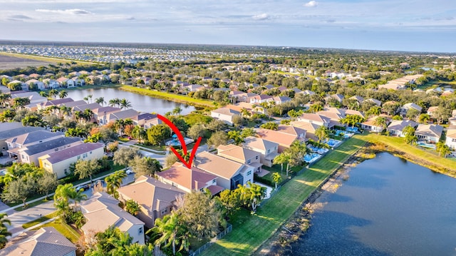 drone / aerial view featuring a water view