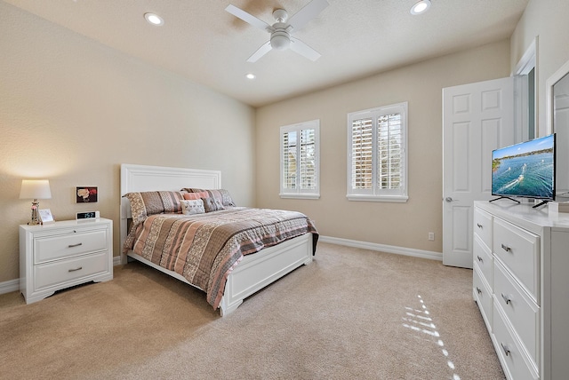 bedroom featuring ceiling fan and light colored carpet