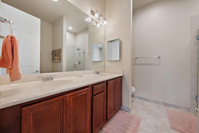 bathroom featuring an enclosed shower, vanity, tile patterned flooring, and toilet