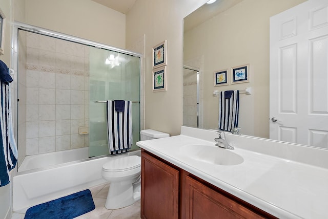 full bathroom with toilet, bath / shower combo with glass door, tile patterned floors, and vanity