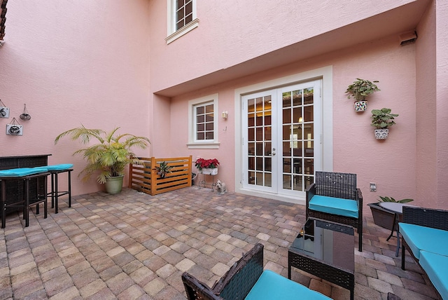 view of patio featuring french doors and an outdoor living space