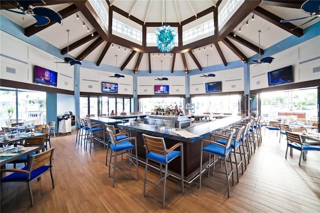 view of patio with a gazebo, ceiling fan, and exterior bar