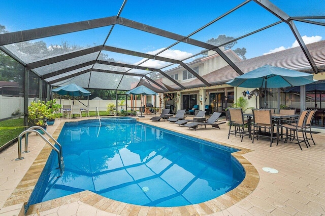 view of pool with a lanai and a patio