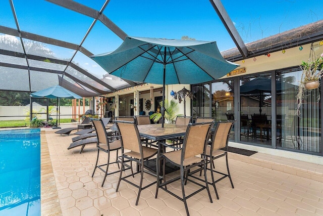 view of patio / terrace with a fenced in pool and glass enclosure