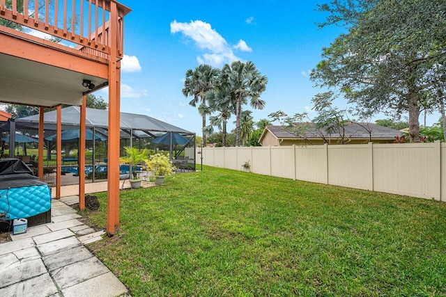 view of yard with glass enclosure