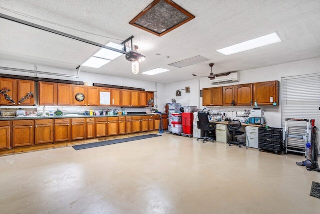 garage with an AC wall unit and a garage door opener