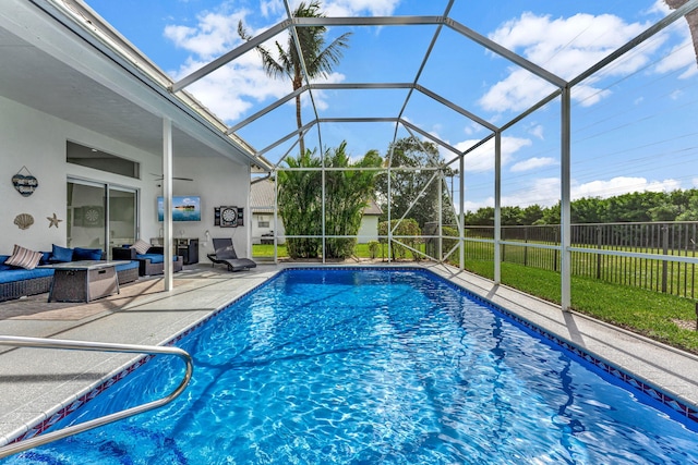 view of pool featuring a lanai and a patio area