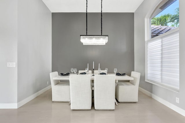 dining space with a notable chandelier