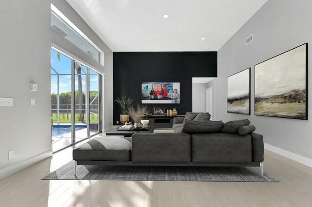 living room with light hardwood / wood-style flooring