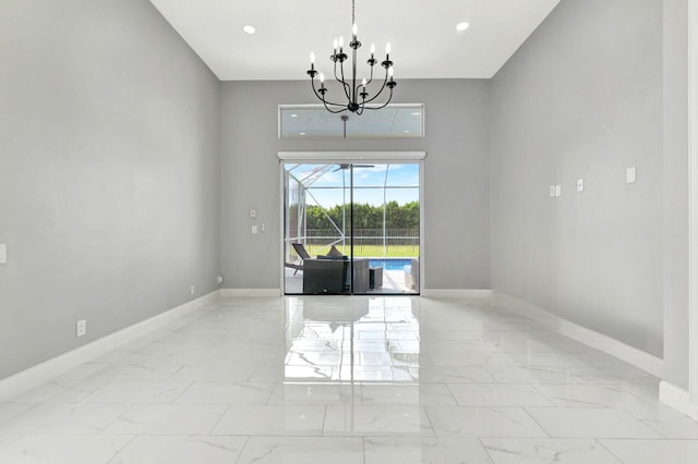 empty room with an inviting chandelier